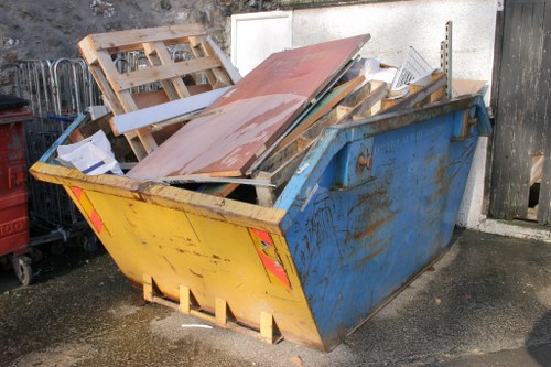 Professional loft clearance team working in Eastham home